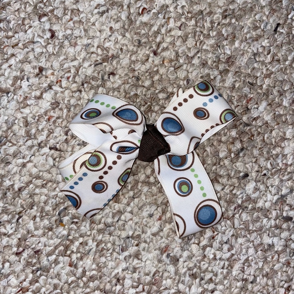 Polka-dot blue green brown and white bow